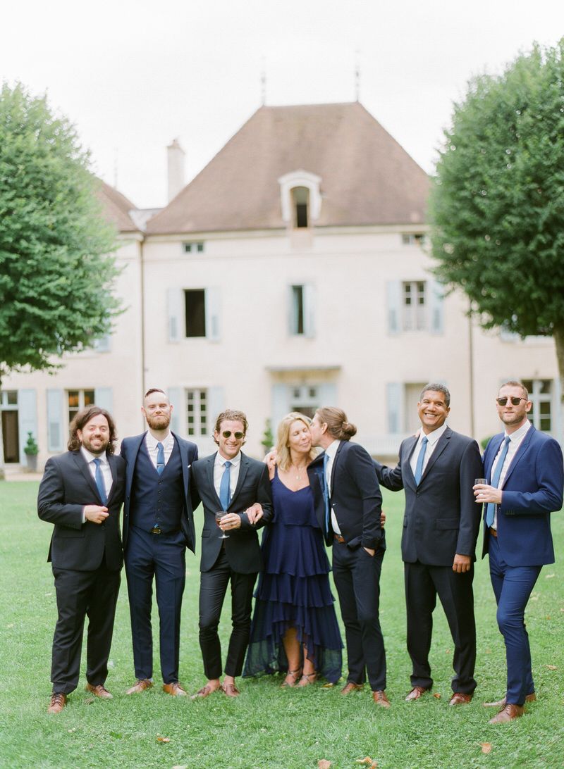 Groom with mom and groomsmen