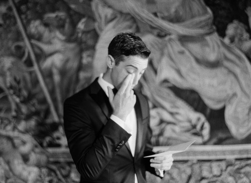 Groom reading letter from a bride